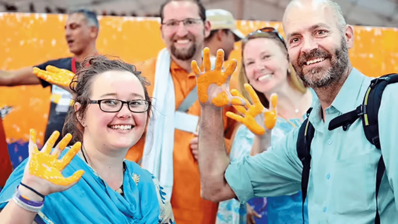 Participants presenting their painted hands at the record event